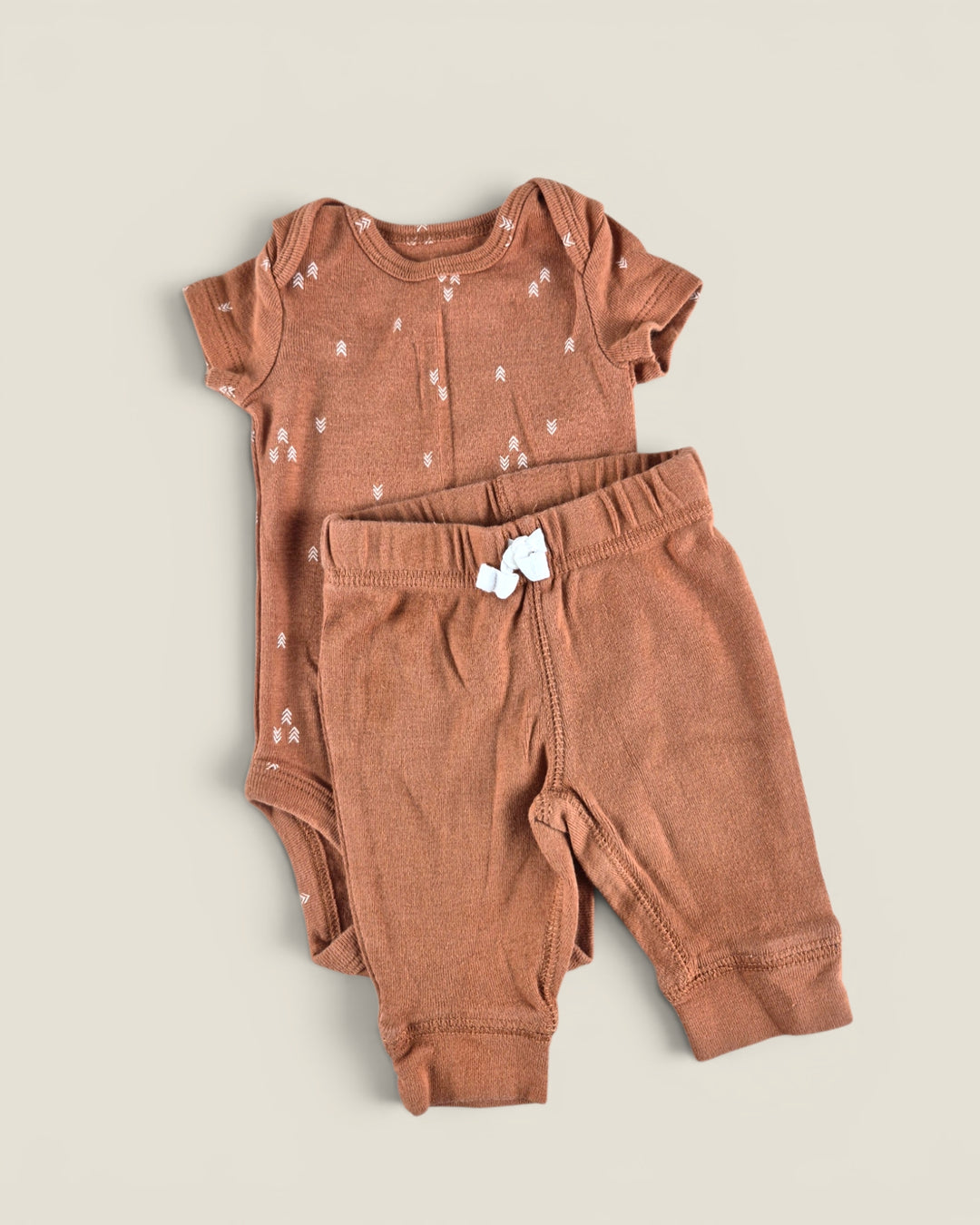 Pre-Loved Carter's Rust Patterned Onesie Outfit NB | Betty’s Marketplace