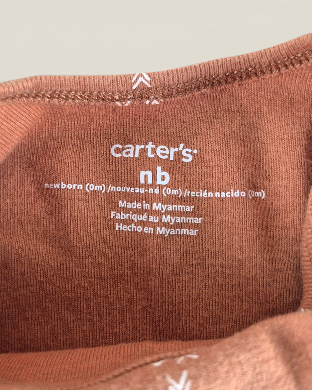 Pre-Loved Carter's Rust Patterned Onesie Outfit NB | Betty’s Marketplace