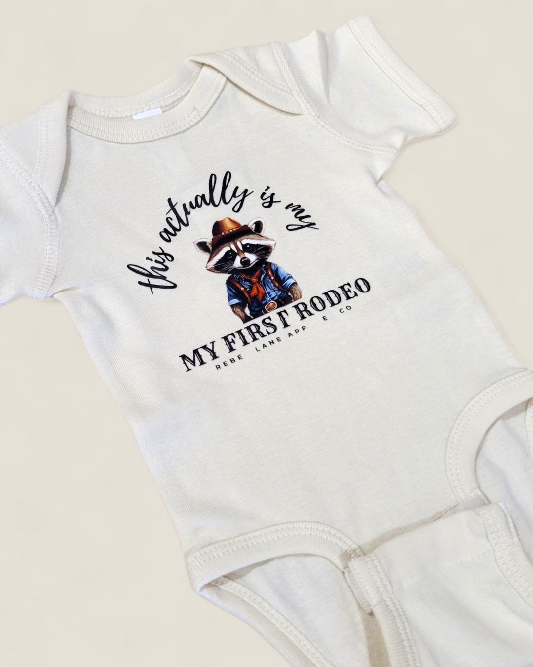 Rebel Lane Apparel Co. My First Rodeo Baby Onesie